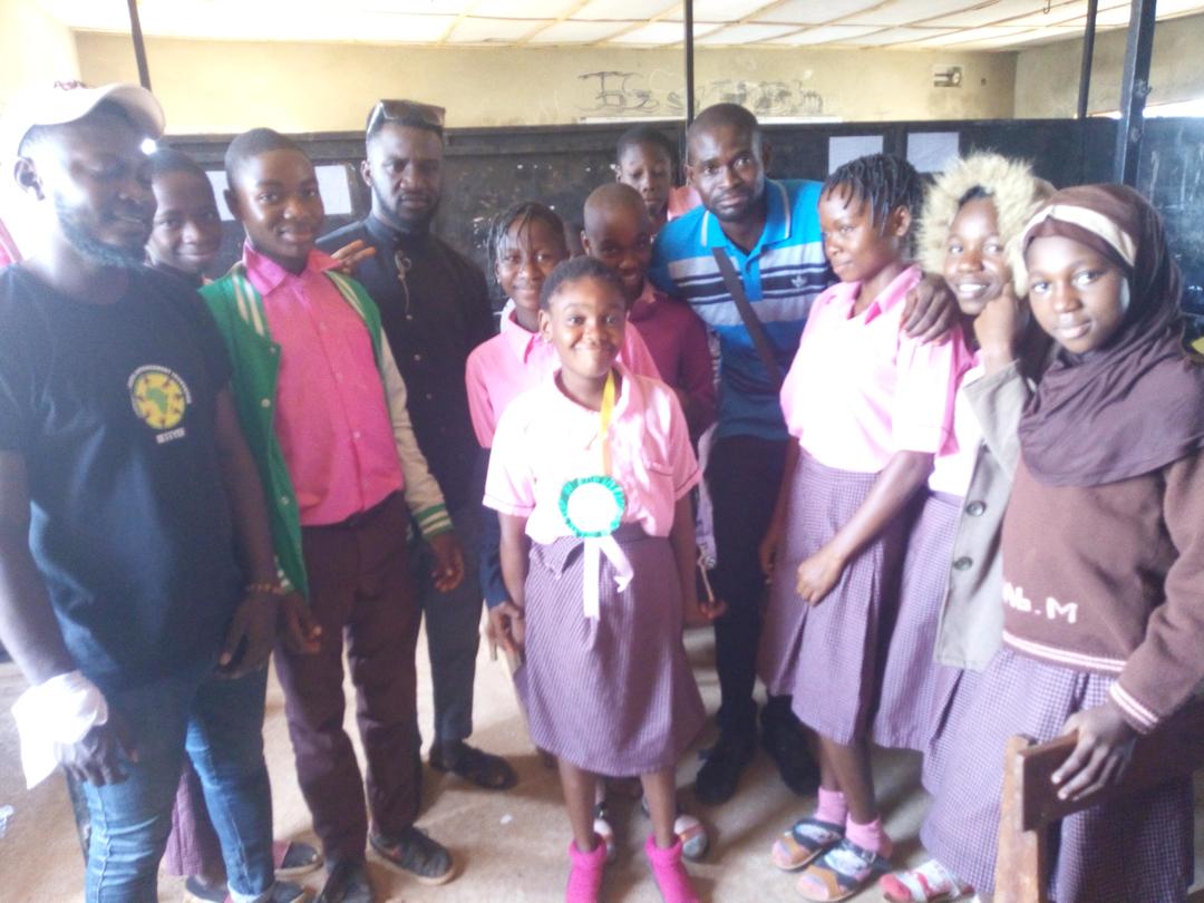 some cross-section of students posing with their award ribbon