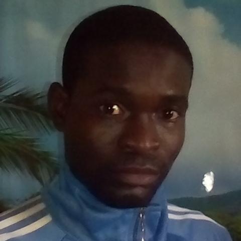 a picture of Amos Omofaiye in a blue tracksuit upper torso