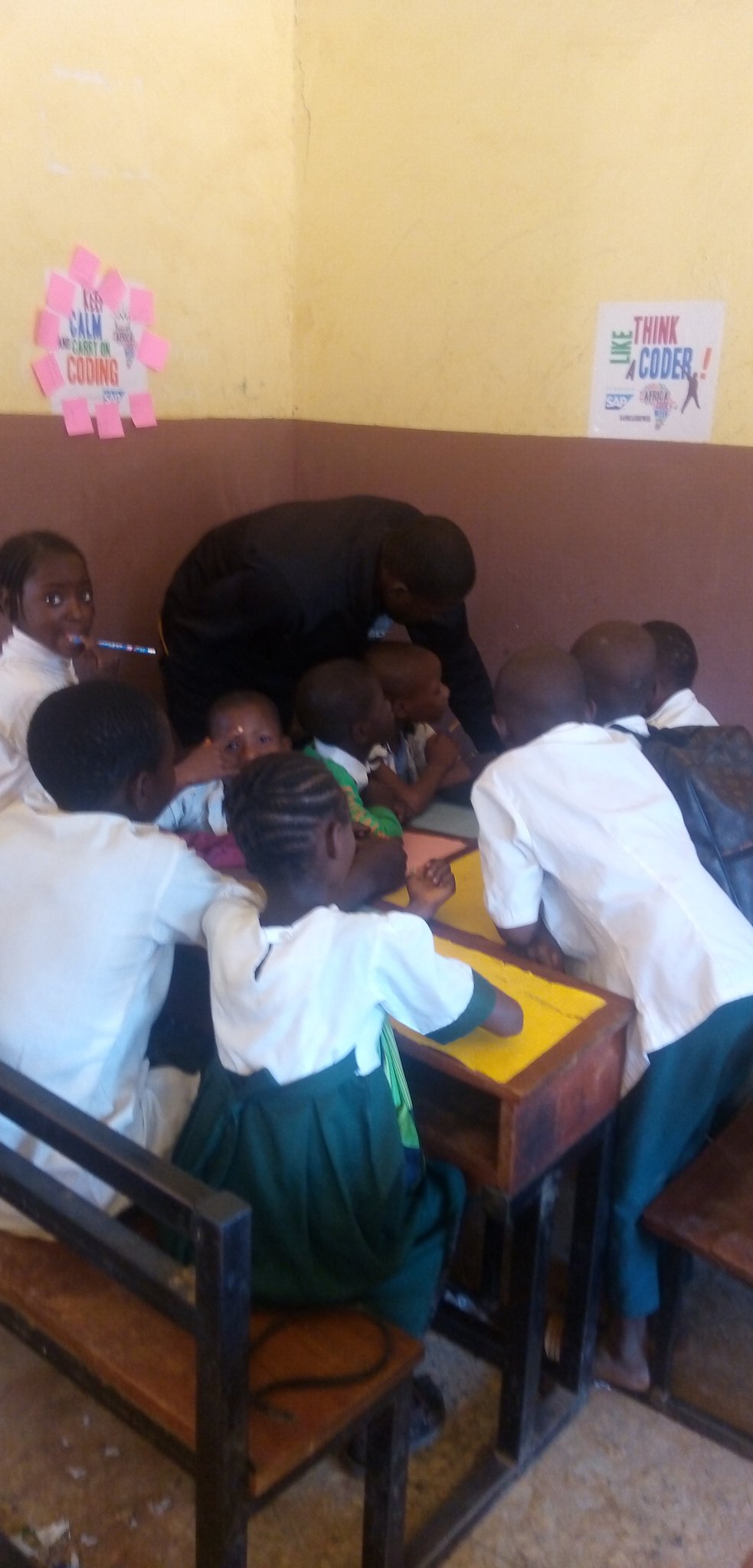 amos teaching pupils how to code
