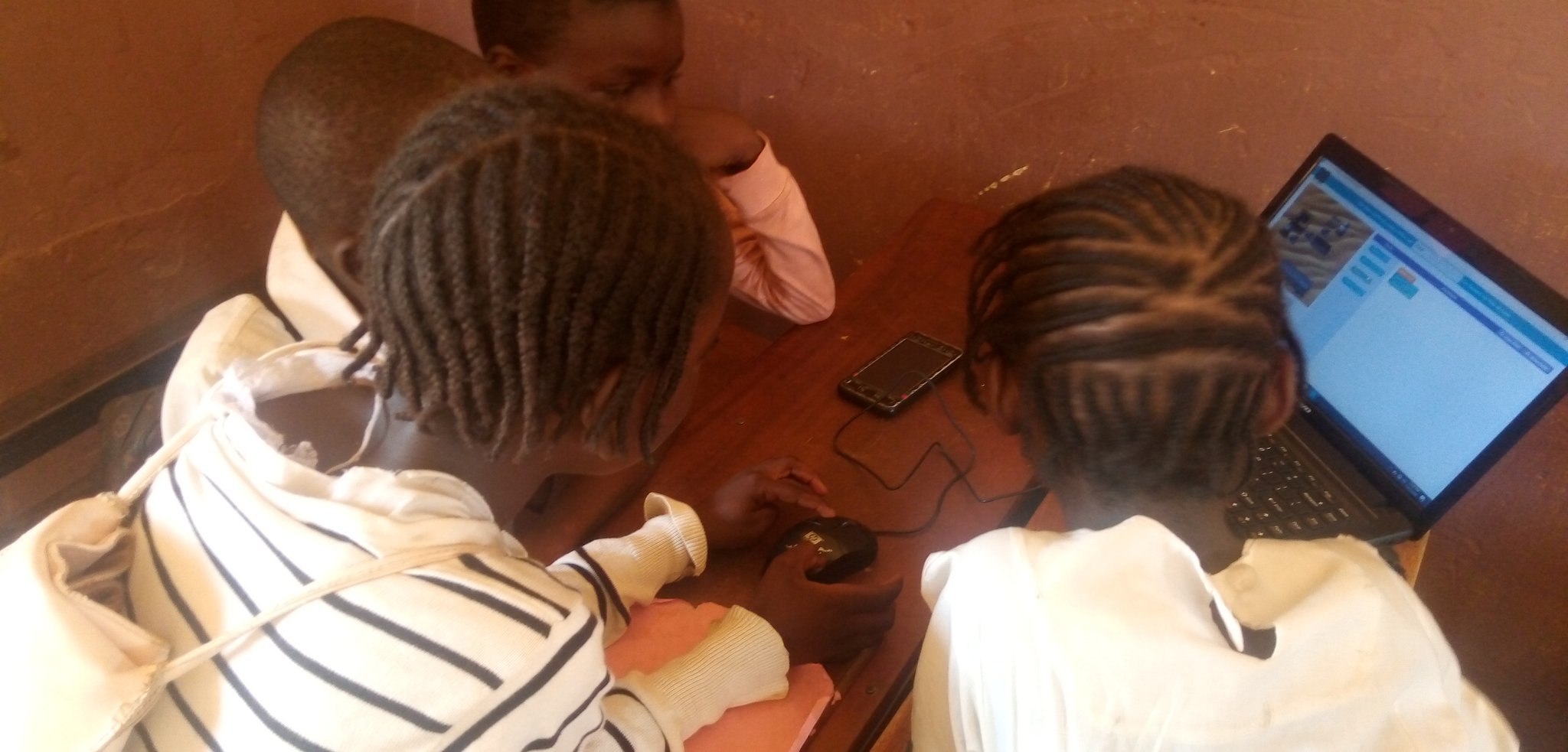 some students studying codes on the system