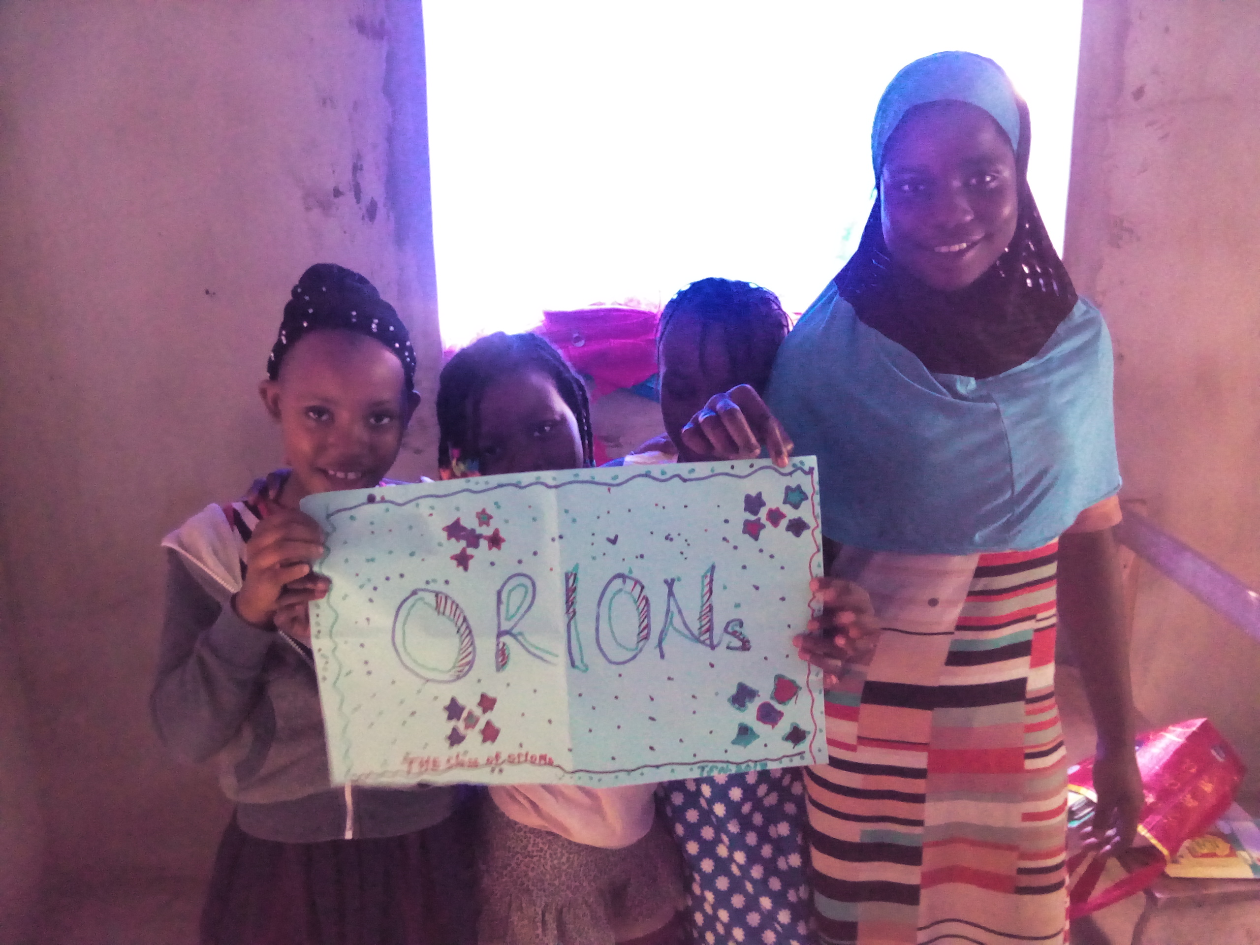 pupils displaying their art work-the class name