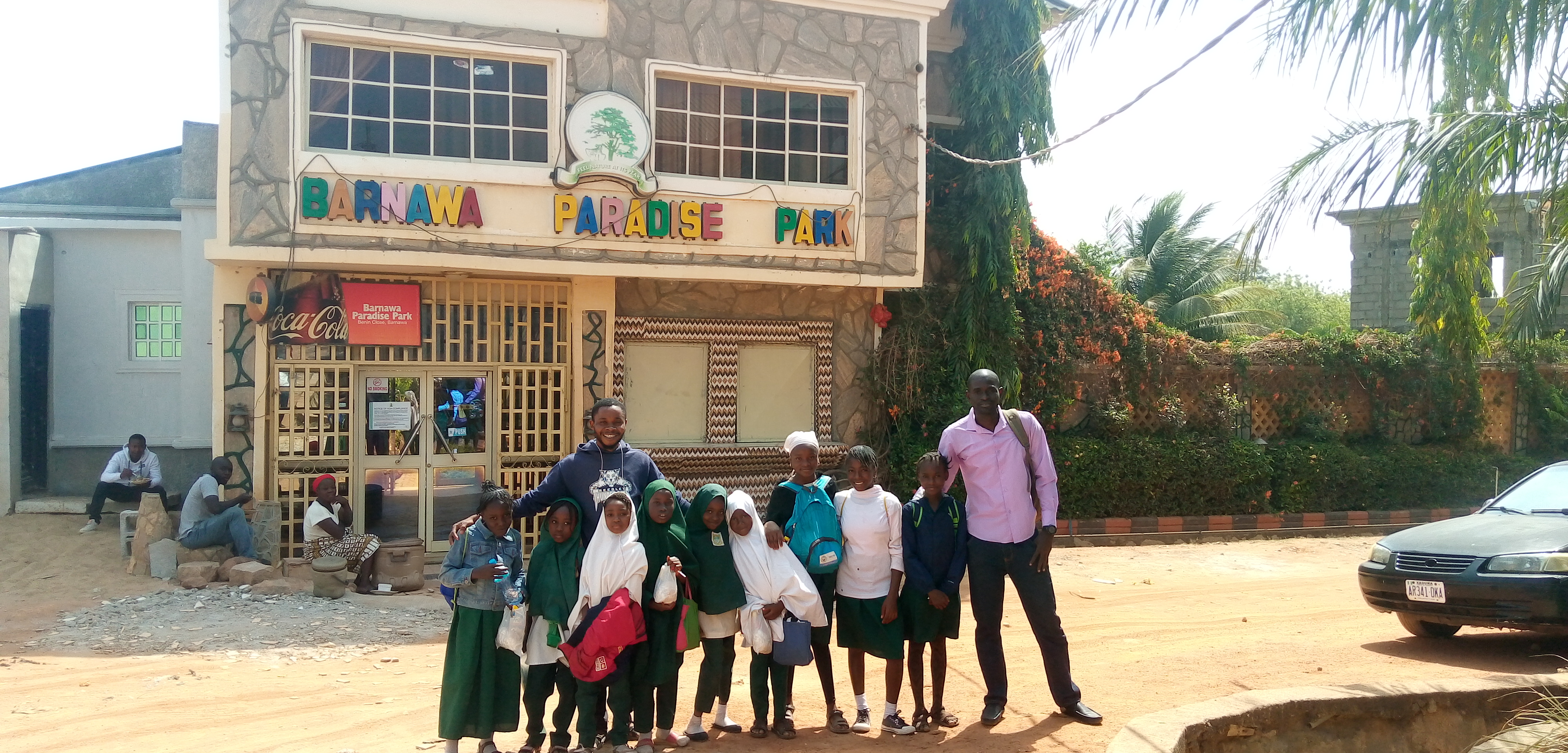 pupils and teachers posing outside the park