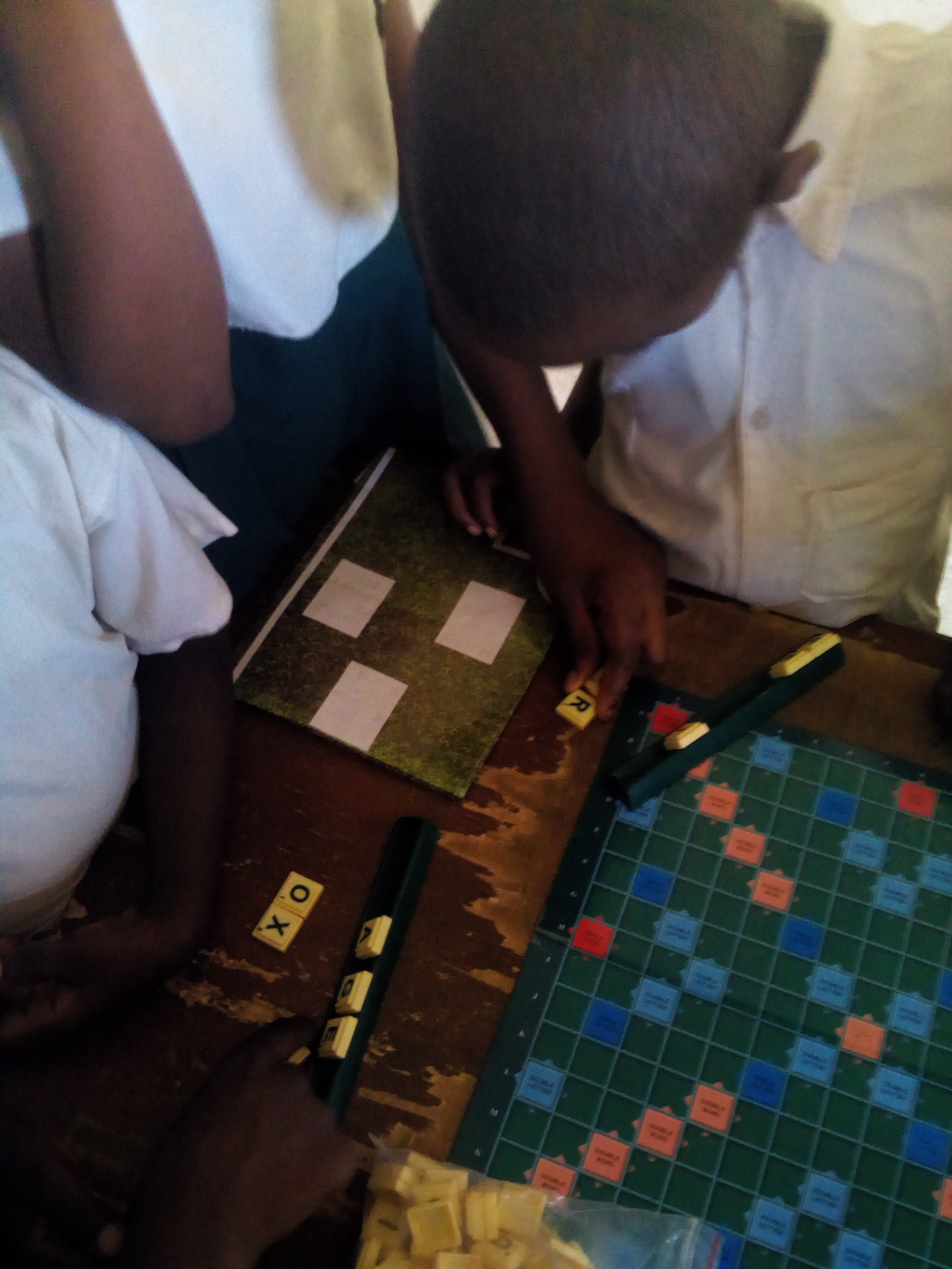 a cross section of gamify participant playing scrabble