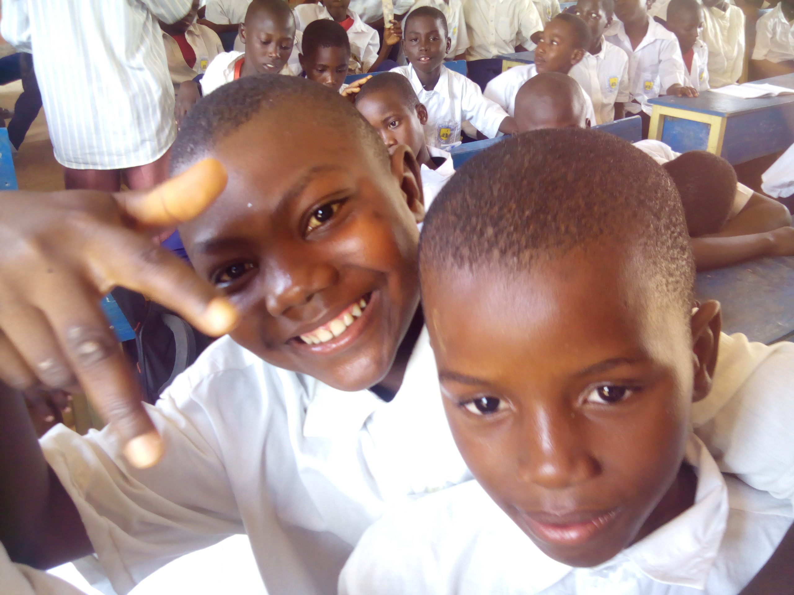 junior students showing the me too sign
