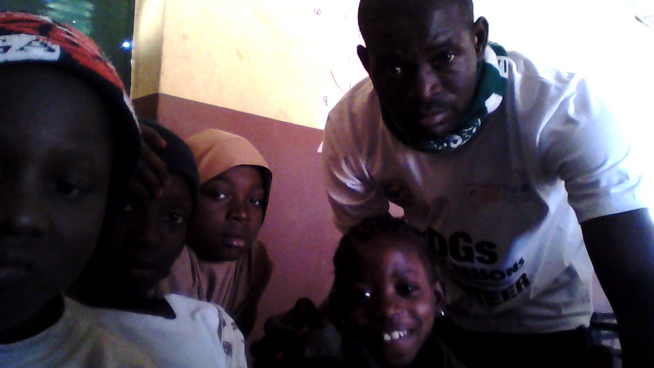 amos posing with children
